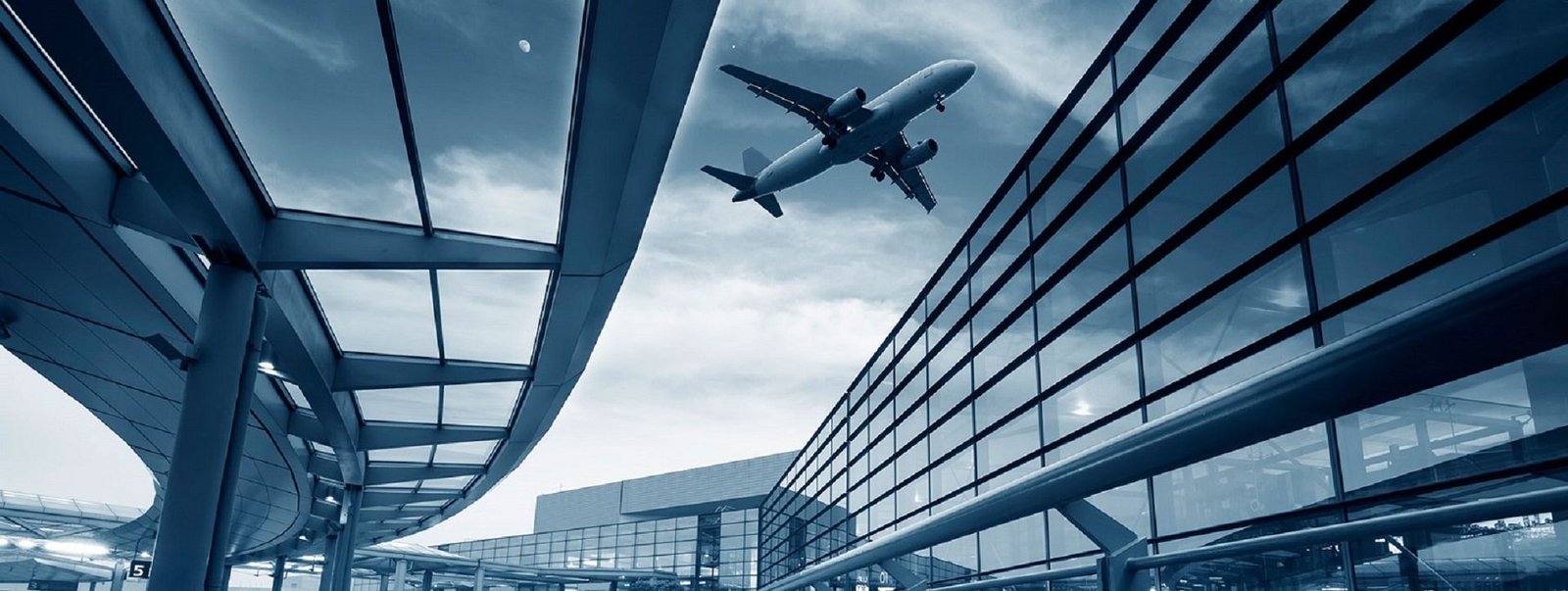 Airport terminal with a plane taking off